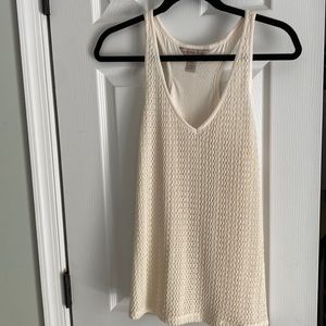 Women’s Banana Republic cream colored top in size M.